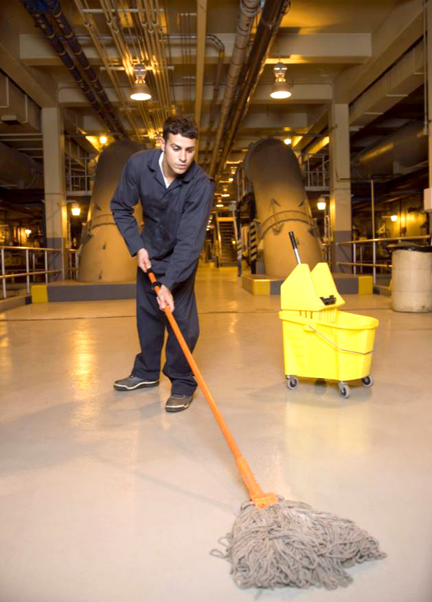 Mopping floor with commercial cleaning bucket