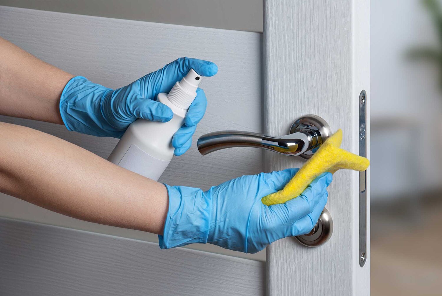 janitor cleaning high touch area